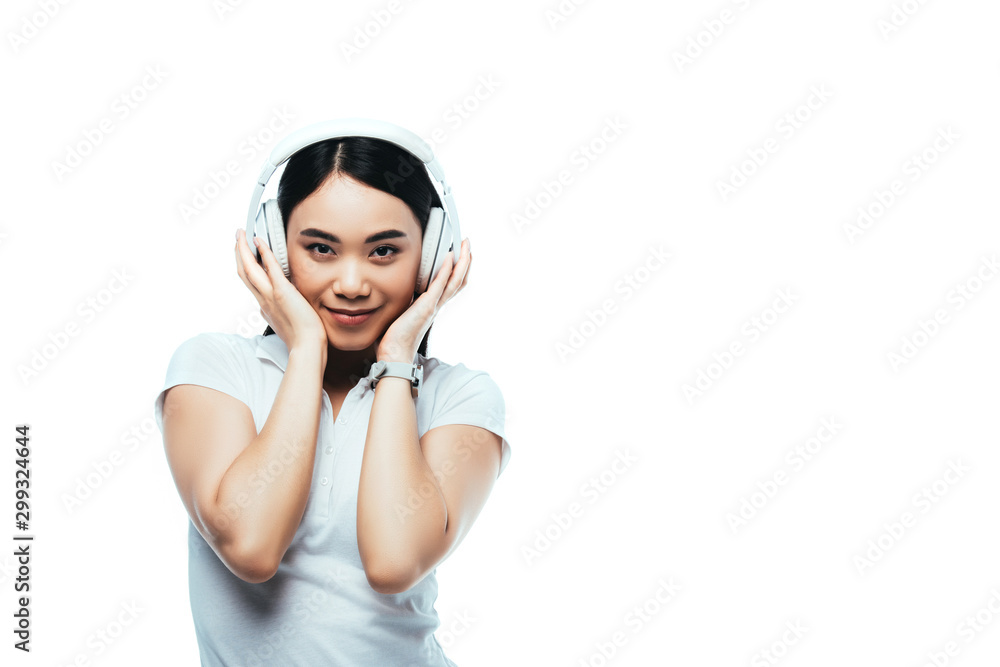 smiling attractive asian girl in headphones isolated on white smiling attractive asian girl in headphones isolated on white