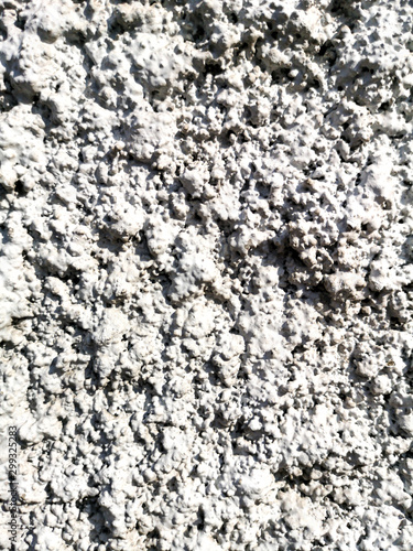 Concrete chips on the wall as abstract background © schankz