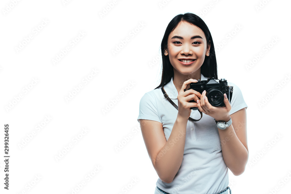 smiling brunette asian woman taking picture on digital camera isolated on white smiling brunette asian woman taking picture on digital camera isolated on white