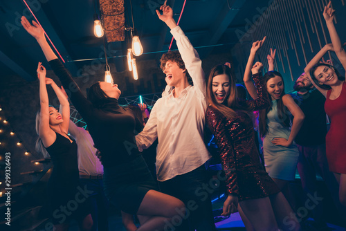 Portrait of positive cheerful couple visit event party dance feel wild crazy rejoice enjoy weekends nightlife event have fun wear formalwear outfit dress in discotheque