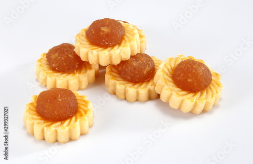 Pineapple tarts or nanas tart are small, bite-size pastries filled or topped with pineapple jam