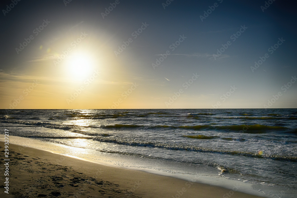 orange sunset on the beach of the Baltic Sea in Poland orange sunset on the beach of the Baltic Sea in Poland