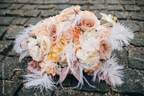 Bouquet of pastel flowers on pavers photo