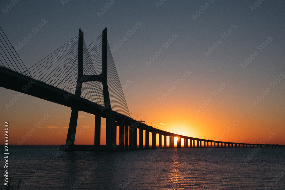 Obraz premium Vasco da Gama Bridge at sunrise in Lisbon, Portugal. Second longest bridge in Europe.