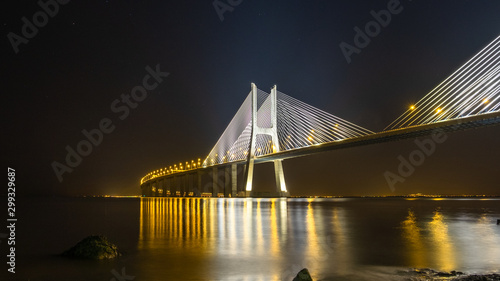 Valokuva Vasco da Gama Bridge lighted at night in Lisbon, Portugal