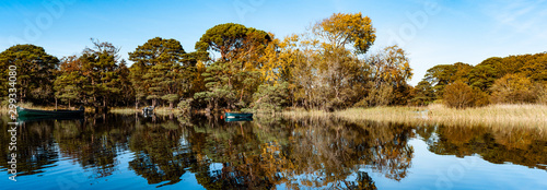 Killarney woods lake reflection in the water, autumn panorama landscape
