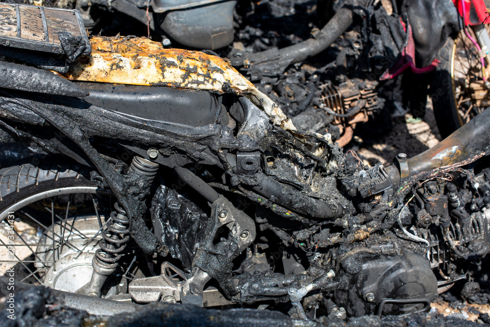 Fototapeta premium Terrorists set fire to motorbikes on a street in the city.