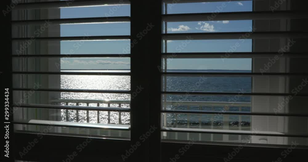 Ocean View through Window Slats During Evening