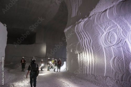 Konstfotografi Miners in underground corridor in salt mine.