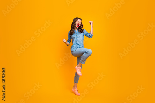 Full length body size turned photo of excited white ecstatic rejoicing girl screaming with overjoying feelings isolated over vivid color background