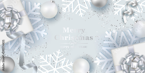 Christmas silver background with realistic  balls and gift boxes. Vector top view illustration. 