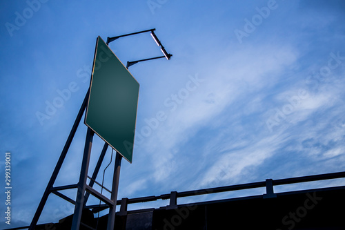 a blank traffic sign board under the blue sky
