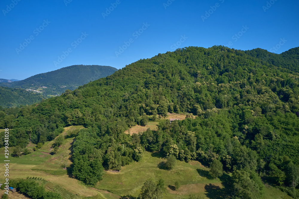 Aerial view of ski resort Madonna di Campiglio, italy. Morning. In the background a clear blue sky Aerial view of ski resort Madonna di Campiglio, italy. Morning. In the background a clear blue sky