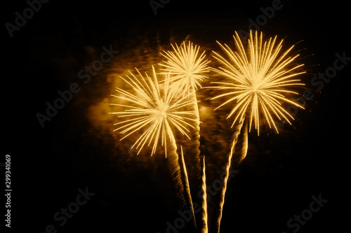 Golden fireworks on a black background