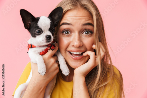 Cute lovely girl playing with her pet chihuahua