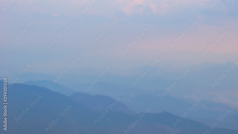 Abstact of landscap of chain mountain / peaks in misty or foggy day in soft focus