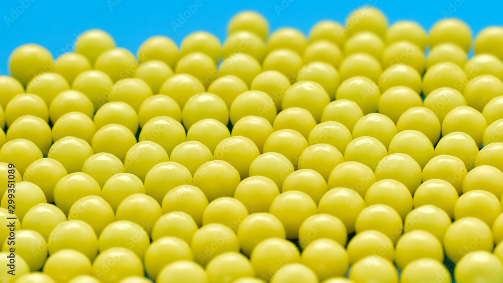 Closeup of yellow balls with ascorbic acid or vitamin C Closeup of yellow balls with ascorbic acid or vitamin C