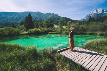 Woman enjoying freedom on nature outdoors. Travel Slovenia Europe.