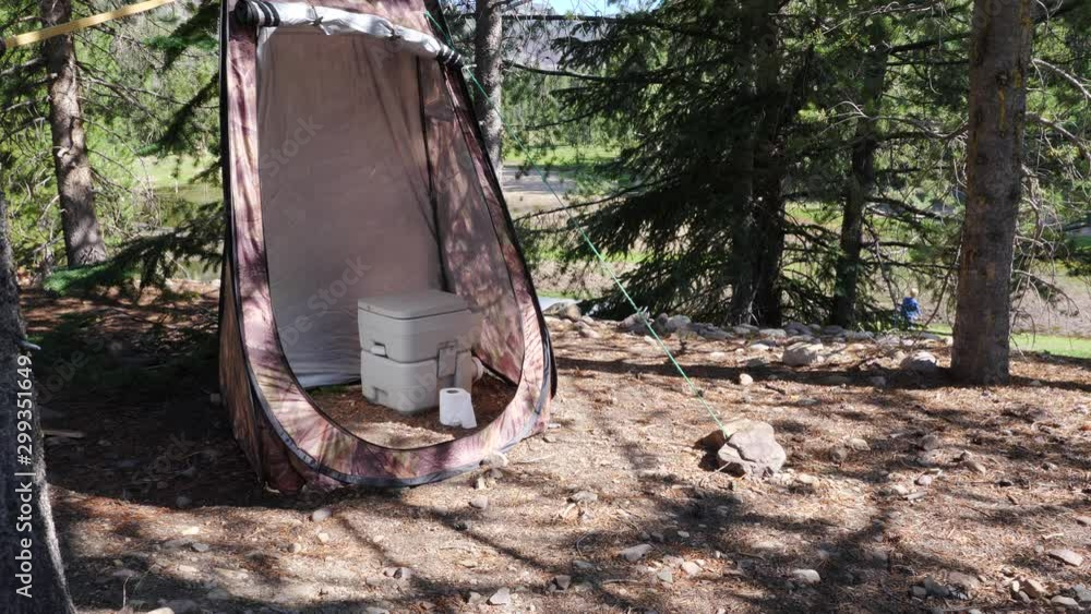Primitive camping, a portable toilet in a privacy tent. 素材庫影片 | Adobe Stock