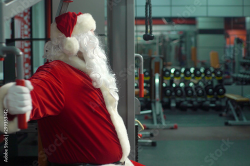 Santa Claus training at the gym on Christmas Day.