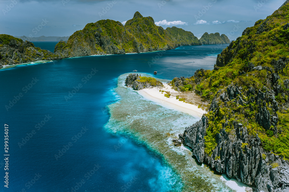 Limestone karst cliffs of Matinloc and Tapuitan Islands and straits between at Palawan, Philippines