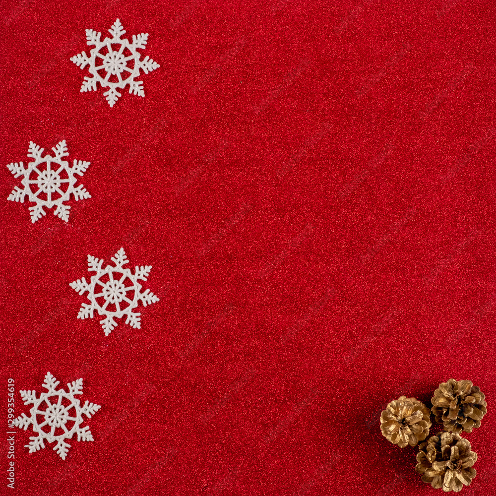 Red New Year's background with cones and snowflakes