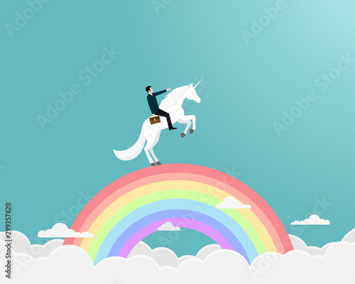 Businessman riding a unicorn on rianbow