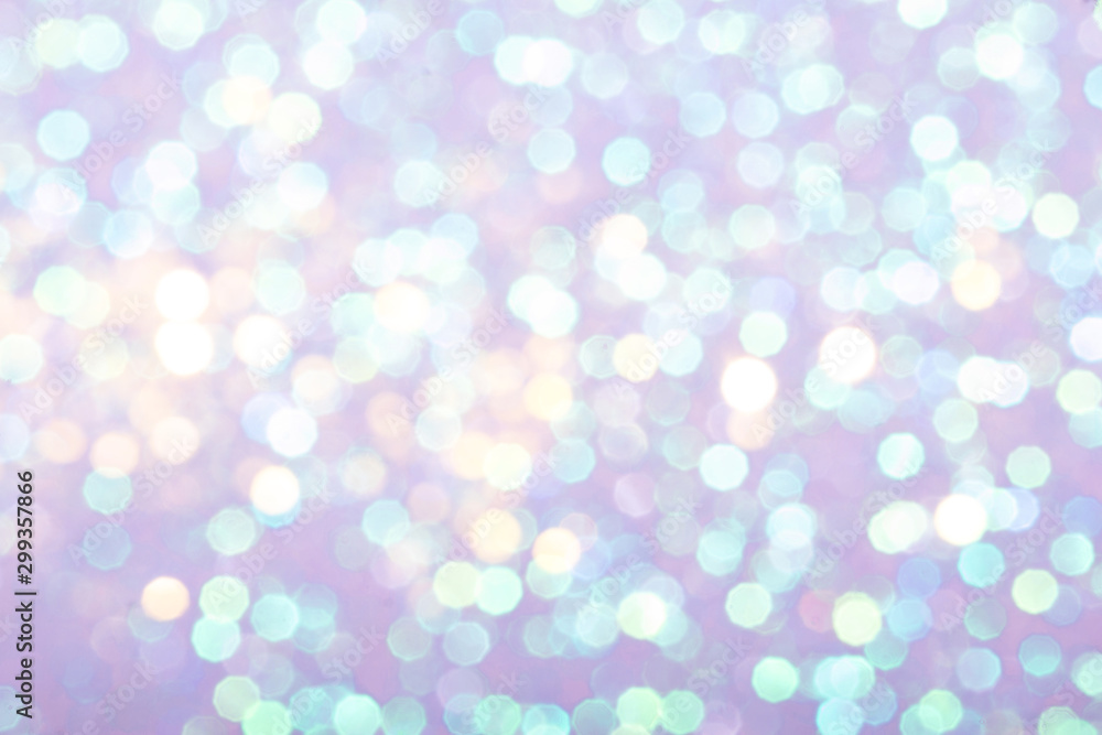 Pastel festive background with sparkles in the bokeh. The concept of the celebration, the day of St. Valentine, New Year, birthdays, ceremonies, events, etc.