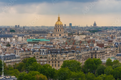 Beautiful aerial cityscape view of Paris with the golden dome of the Les Invalides complex surrounded by the typical Parisian residential buildings on a summer day.  © H-AB Photography