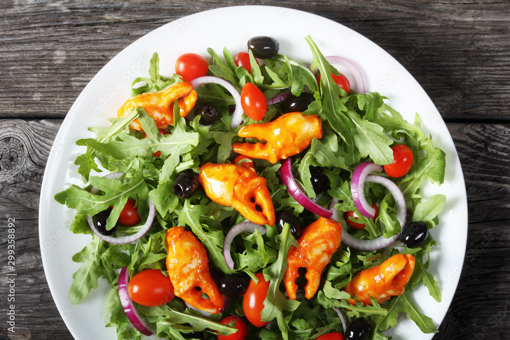 arugula crab clamps salad on a plate arugula crab clamps salad on a plate