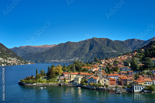 Panoramic top view of Lake Como. Lombardy, Italy. The small town of Torno. Autumn season. Perfect clear blue sky. Boats parked off the coast © Berg