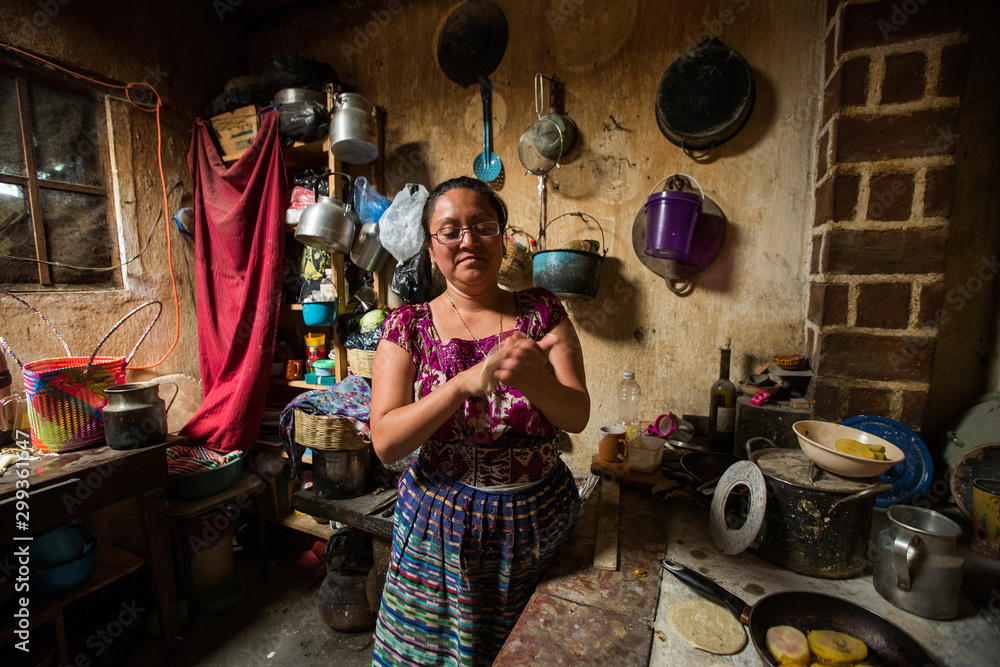 Guatemalan woman makint tortillas in San Juan La Laguna, Lake Atitlan, Guatemala