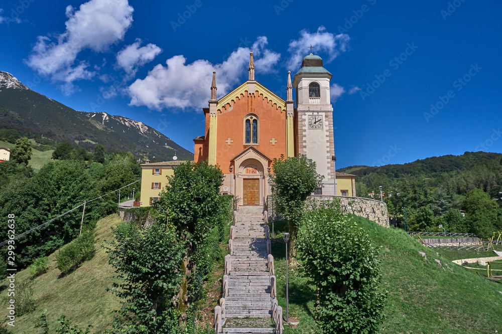 Panorama view of Parrocchia S. Caterina V.M. Ferrara di Monte Baldo is a city in the province of Verona. Flight by a drone. Popular travel destination in Nothern Italy.