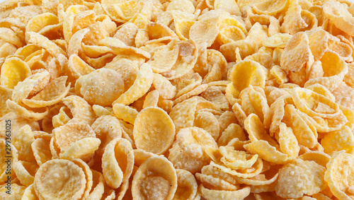 Corn-flakes background and texture. Top view. Traditional dry breakfast cereal. Placer of corn flakes on a white background.