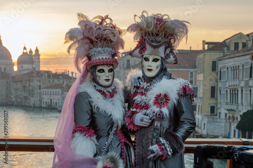 Masked and dressed up couple posing