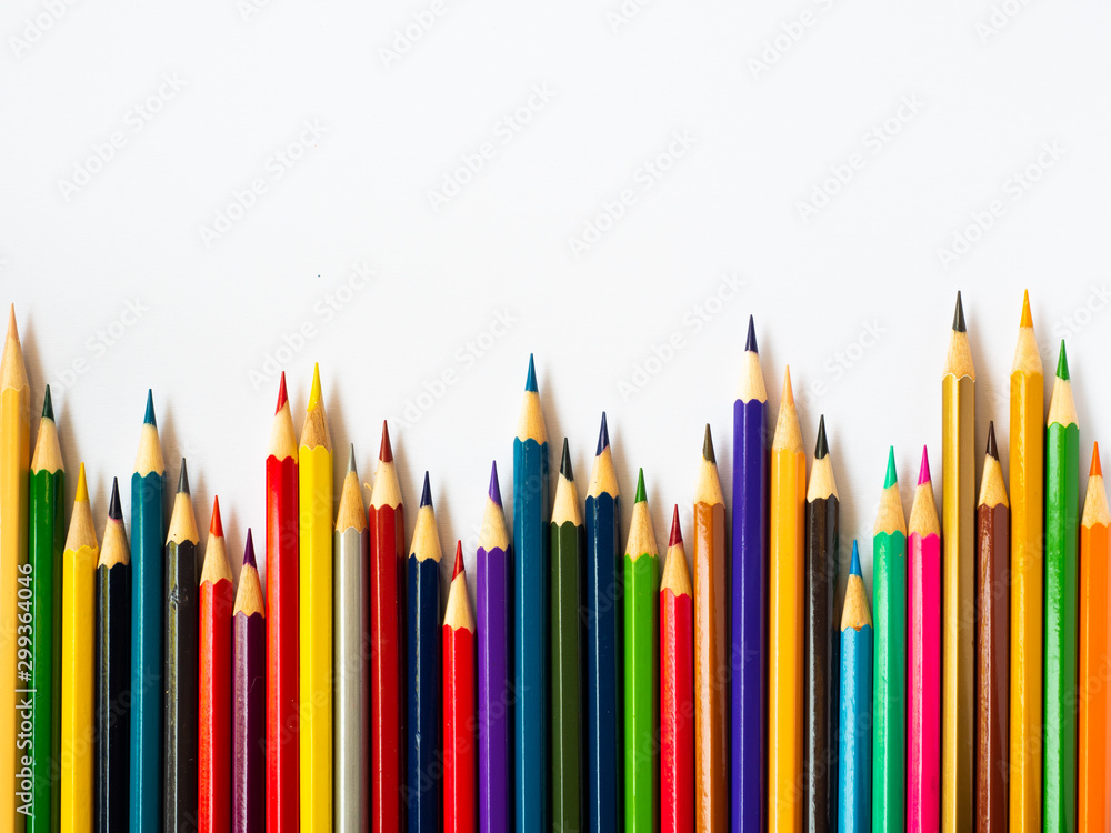 Colored pencils on white wooden background, Stationery Concept. Top view with copy space. Colored pencils on white wooden background, Stationery Concept. Top view with copy space.