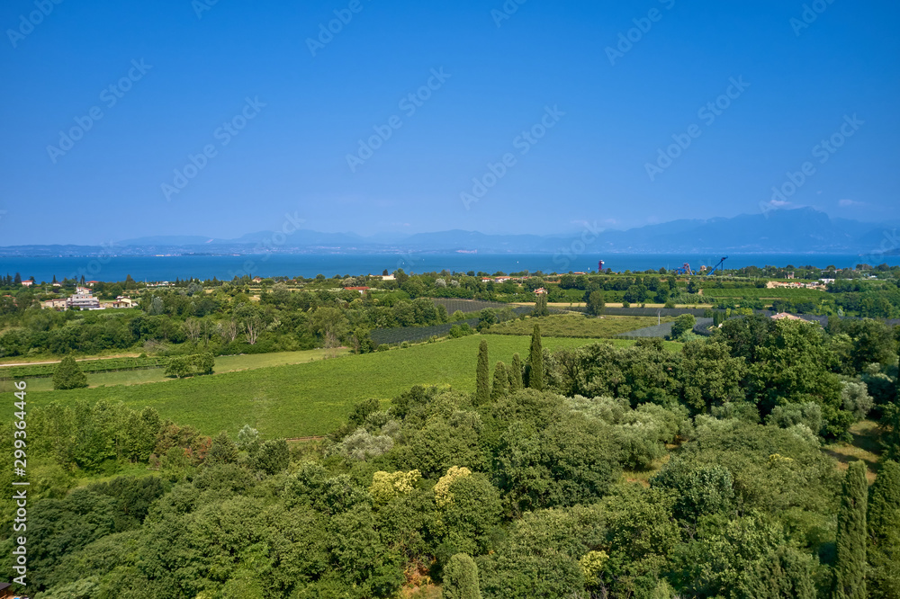 Panoramic view of the meadows and mountains of Lake Garda Panoramic view of the meadows and mountains of Lake Garda