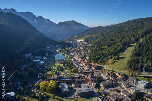 Aerial view of ski resort Madonna di Campiglio, italy. Morning is the autumn season. In the background a clear blue sky