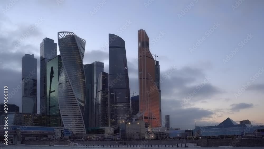 Time Lapse. Day to Night. Financial district of Moscow with futuristic glass skyscrapers. Heavy traffic on the waterfront. Night life of the modern city. HyperLapse. Ultra HD stock footage Time Lapse. Day to Night. Financial district of Moscow with futuristic glass skyscrapers. Heavy traffic on the waterfront. Night life of the modern city. HyperLapse. Ultra HD stock footage