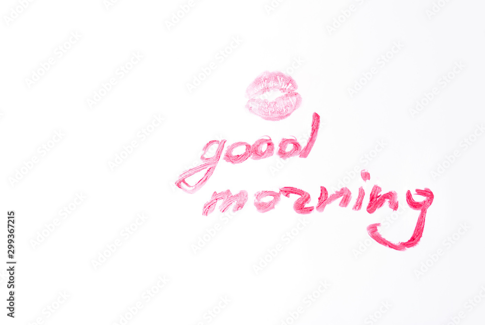 the imprint of a kiss with bright lipstick and lipstick inscription good morning on a white background the imprint of a kiss with bright lipstick and lipstick inscription good morning on a white background
