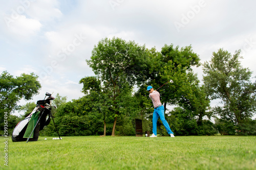 Young man playing golf