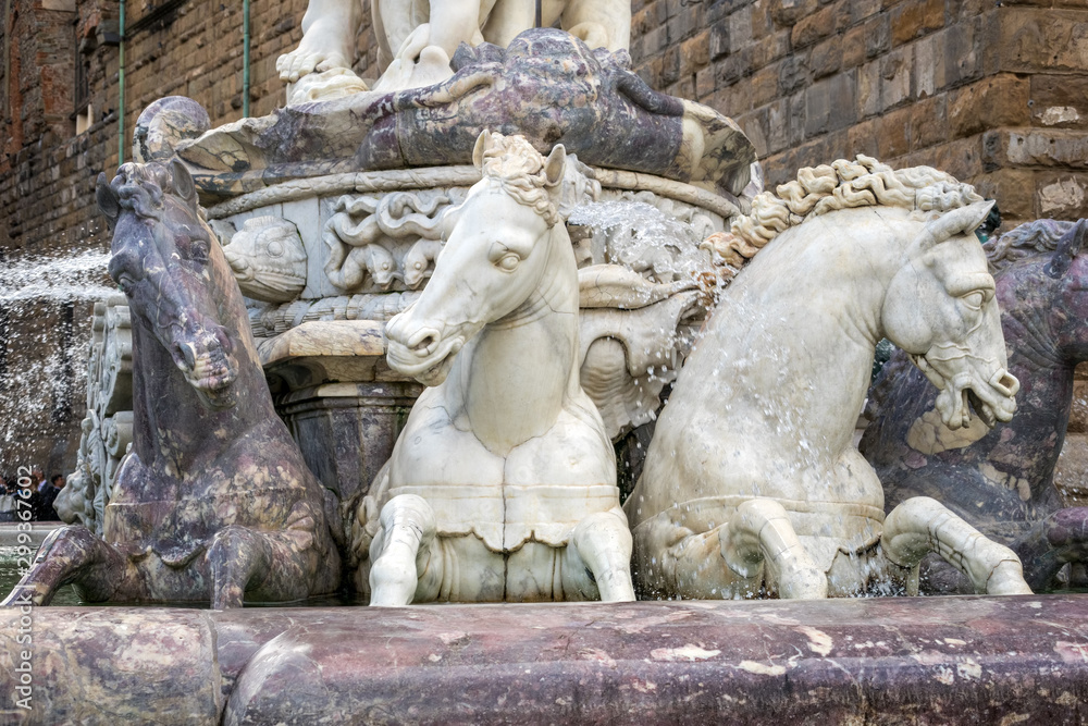 FLORENCE, TUSCANY/ITALY - OCTOBER 19 : Detail from the Fountain of Neptune statue Piazza della Signoria in front of the Palazzo Vecchio Florence on October 19, 2019