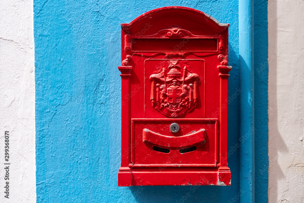 Red mail box. Red decorative mailbox in the village of Burano in Venetian Lagoon. Colourful post box in Burano, Italy. Red mail box. Red decorative mailbox in the village of Burano in Venetian Lagoon. Colourful post box in Burano, Italy.
