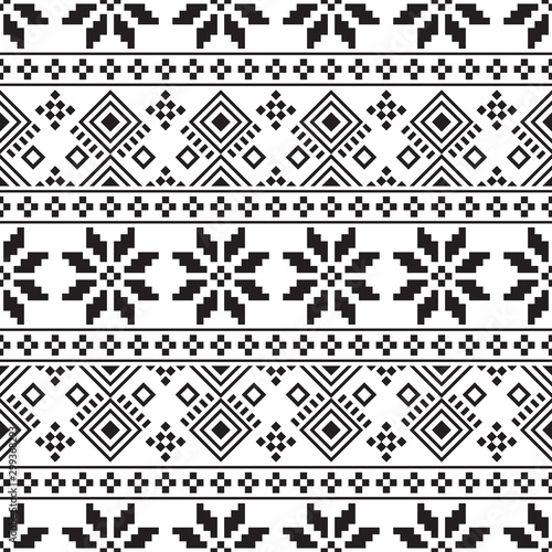 Knitted Christmas Ethnic pattern on white background. Ornament. Border. Seamless sample. It can be used as a background. Vector illustration.