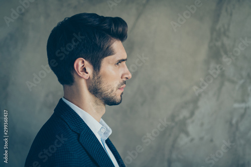 Close up photo of serious thinking guessing man with stubble looking pensively into empty space isolated grey color background