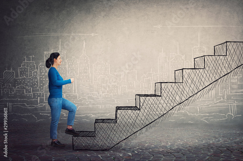 фотографія Motivated and confident young woman hurry to climb a imaginative staircase