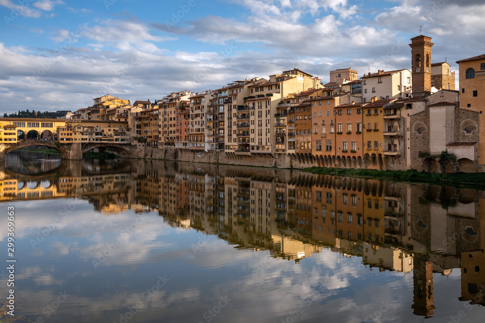 FLORENCE, TUSCANY/ITALY - OCTOBER 18 : View of buildings along and across the River Arno in Florence  on October 18, 2019. Unidentified people.