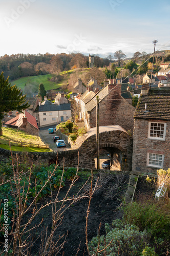 Houses in Richmond, North Yorkshire and Culloden Tower in the background, viewed from the castle walk with autumn colours photo