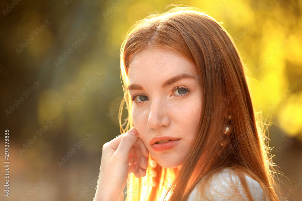 Beautiful young woman posing on blurred background Beautiful young woman posing on blurred background