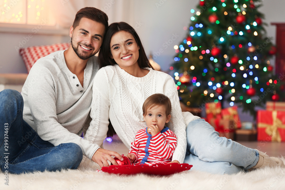Happy family with cute baby at home. Christmas celebration Happy family with cute baby at home. Christmas celebration